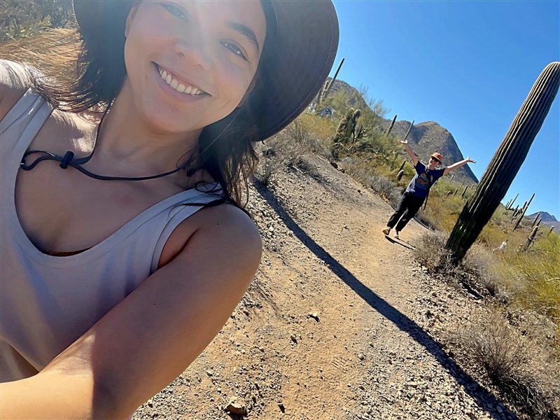 Vanessa smiling on a desert trail near Tucson